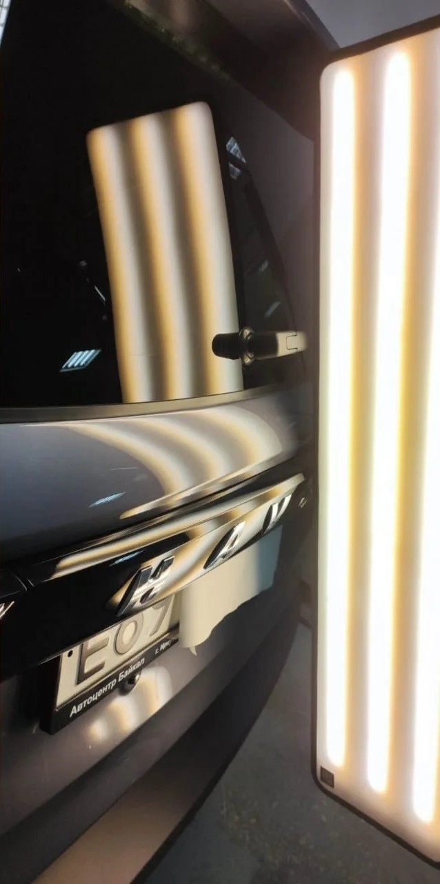 Капот автомобиля Haval после выправления вмятины без покраски